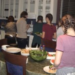 Sport group preparing meal at the Presidents' Suites / Groupe sportif préparant un repas aux Suites des Présidents