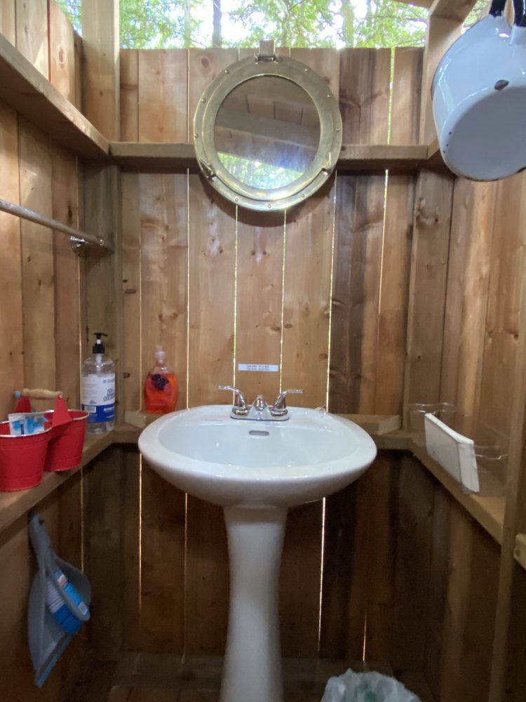 Sink inside compostable outhouse glamping Farr Island